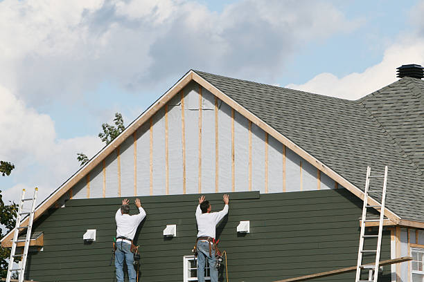 Professional Storm Damage Siding Repair technician working in Warsaw, IL